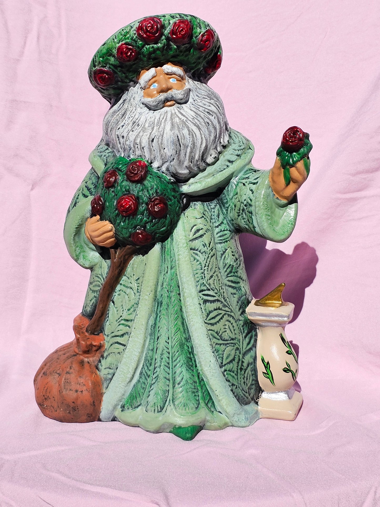 Old world ceramic Santa with pointset
